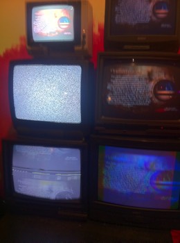  Custom low tech video wall from recycled television monitors for private party 